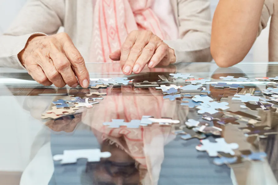 older woman doing a puzzle